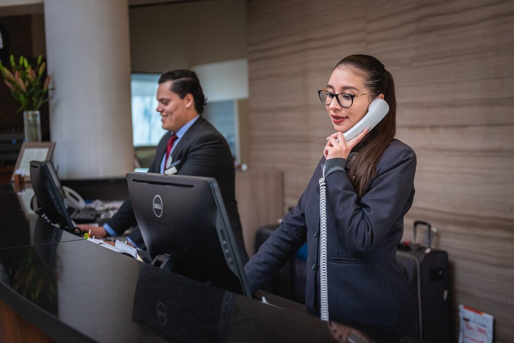 receptionists, phone call, hotel, reception, woman, man, work, attention, lobby, employees, professional, company, assistance, hotel, hotel, hotel, hotel, hotel, reception